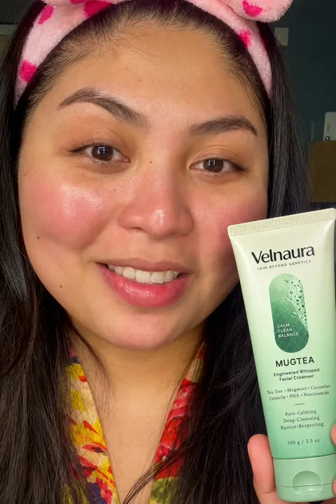 A woman wearing a pink headband takes a selfie with Mugtea.